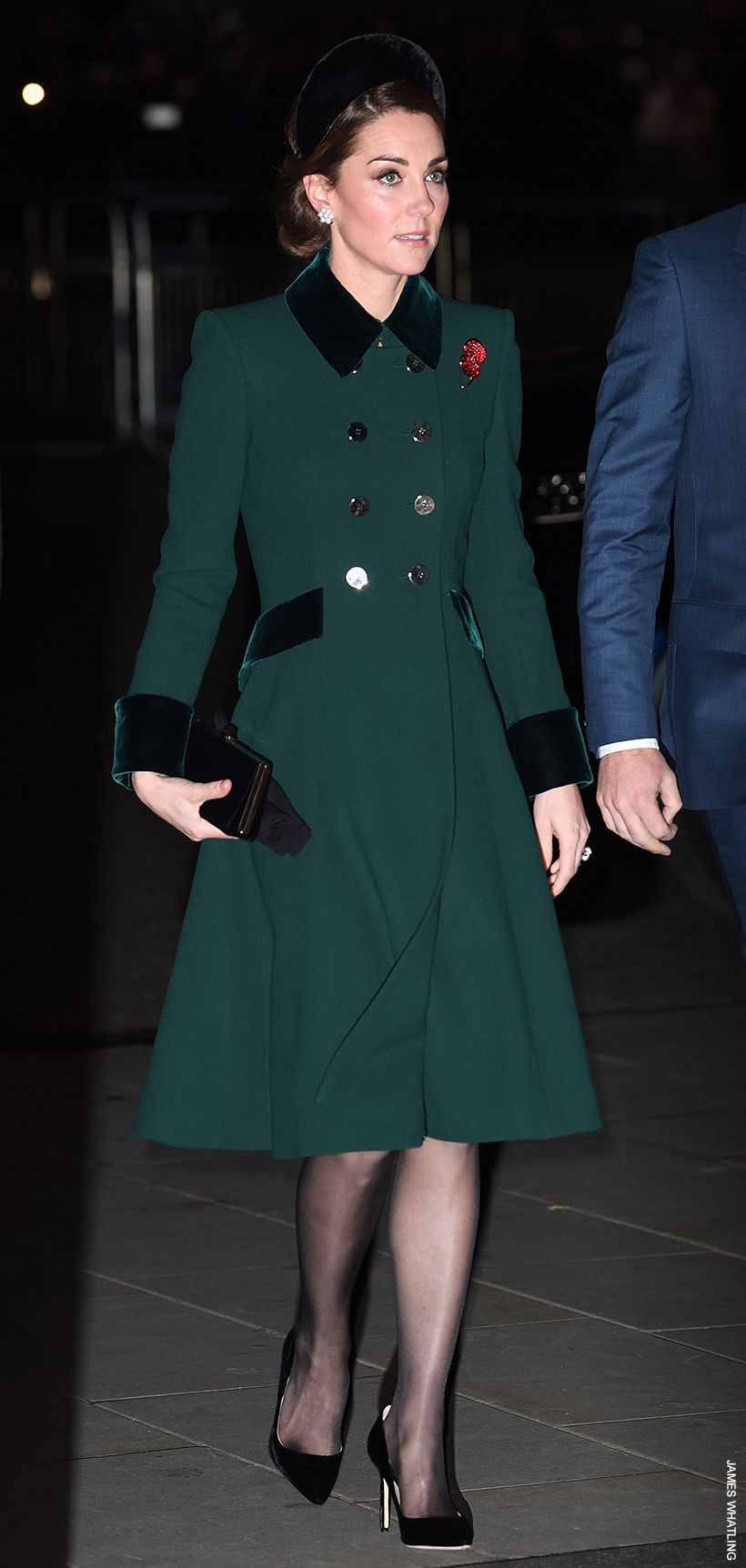 Kate Middleton looks super chic in this green coat with velvet trim.