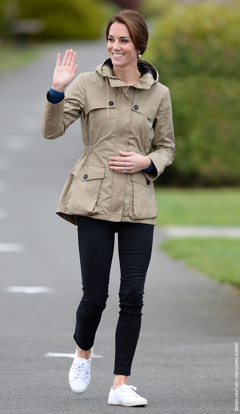 Casual Kate Middleton dresses for autumn in a khaki wax parka, jeans and sneakers.