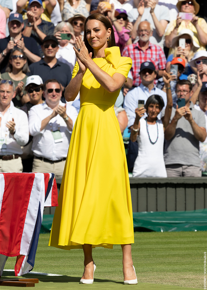 The Princess of Wales at wimbledon, wearing the same yellow dress, clapping.