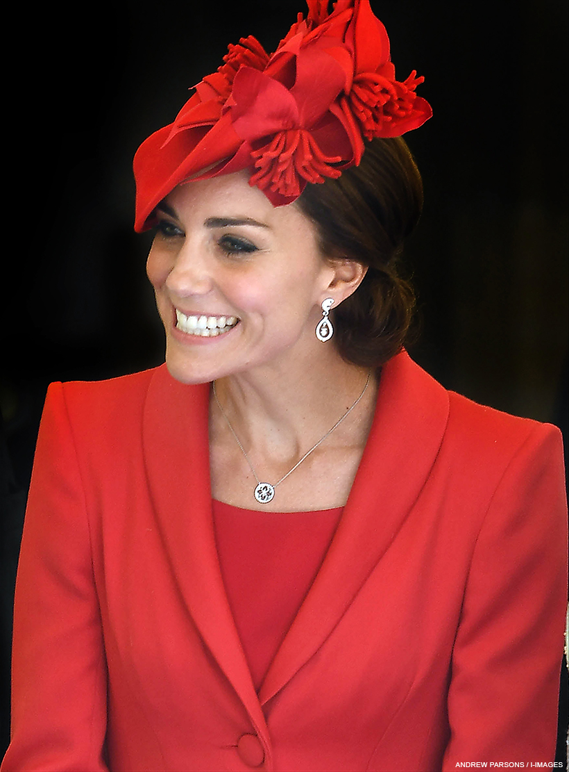 Princess of Wales wearing formal red clothing and hat.  She is wearing the white gold Empress necklace.