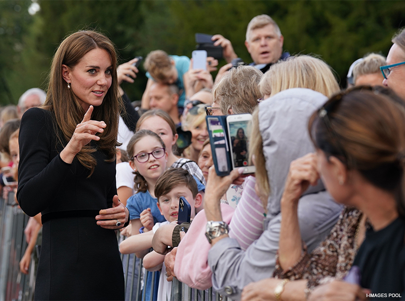 Kate Middleton — now the Princess of Wales — speaks to wellwishers outside of the castle.