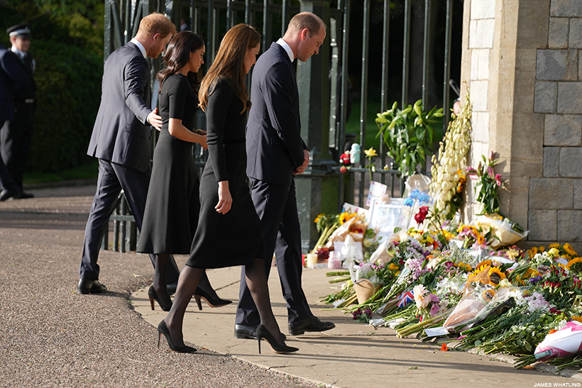 The four royals looking at the floral tributes together 