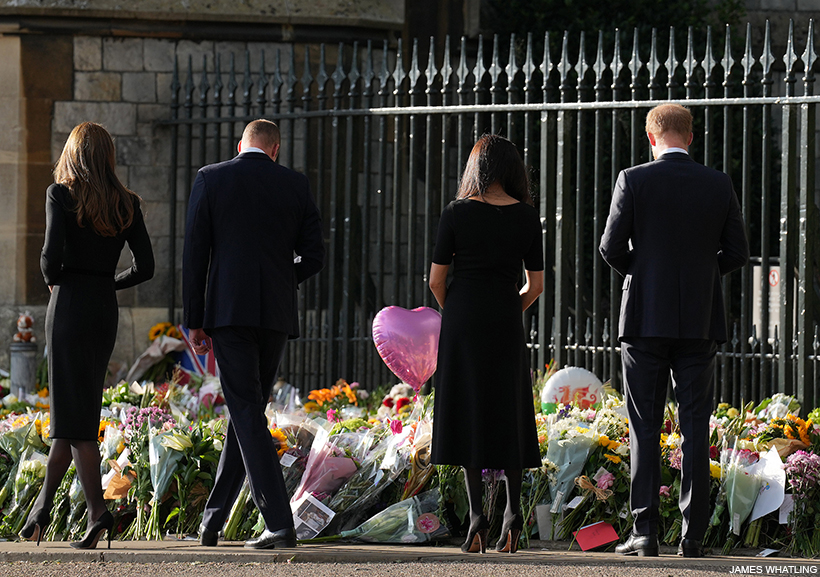 William, Kate, Meghan and Harry look at floral tributes to the Queen outside of Windsor Castle