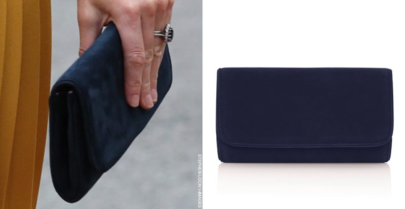 Kate Middleton carrying the Emmy London natasha bag in navy vs stock image from the brand