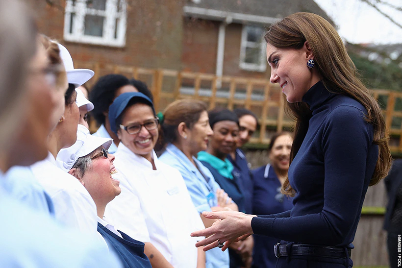 Kate Middleton remixes camel and navy for nursing home visit