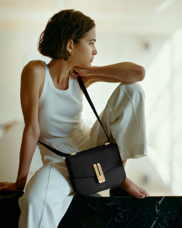Model wearing a DeMellier bag