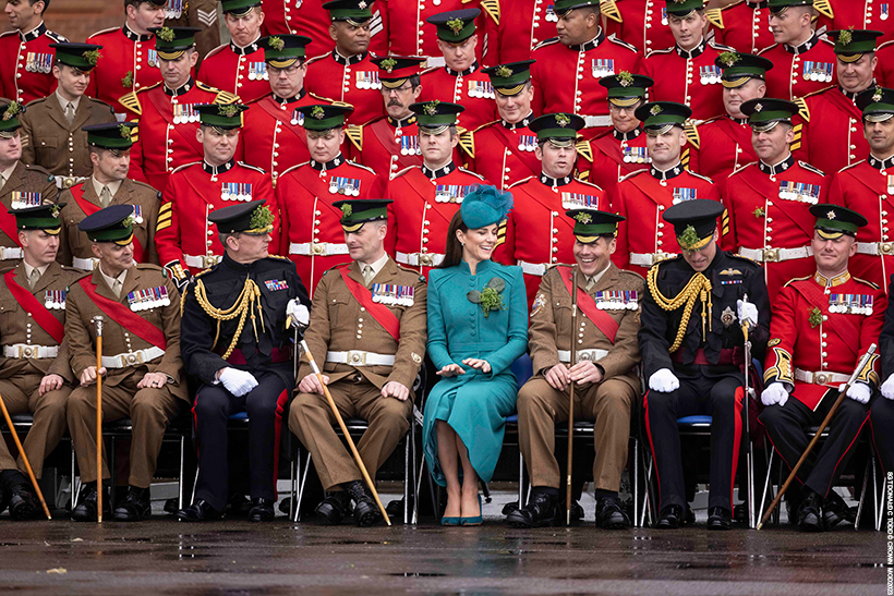 Princess Kate wears a gorgeous green-blue military coat dress with matching accessories - she contrasts vibrantly against the Irish Guards' uniforms 