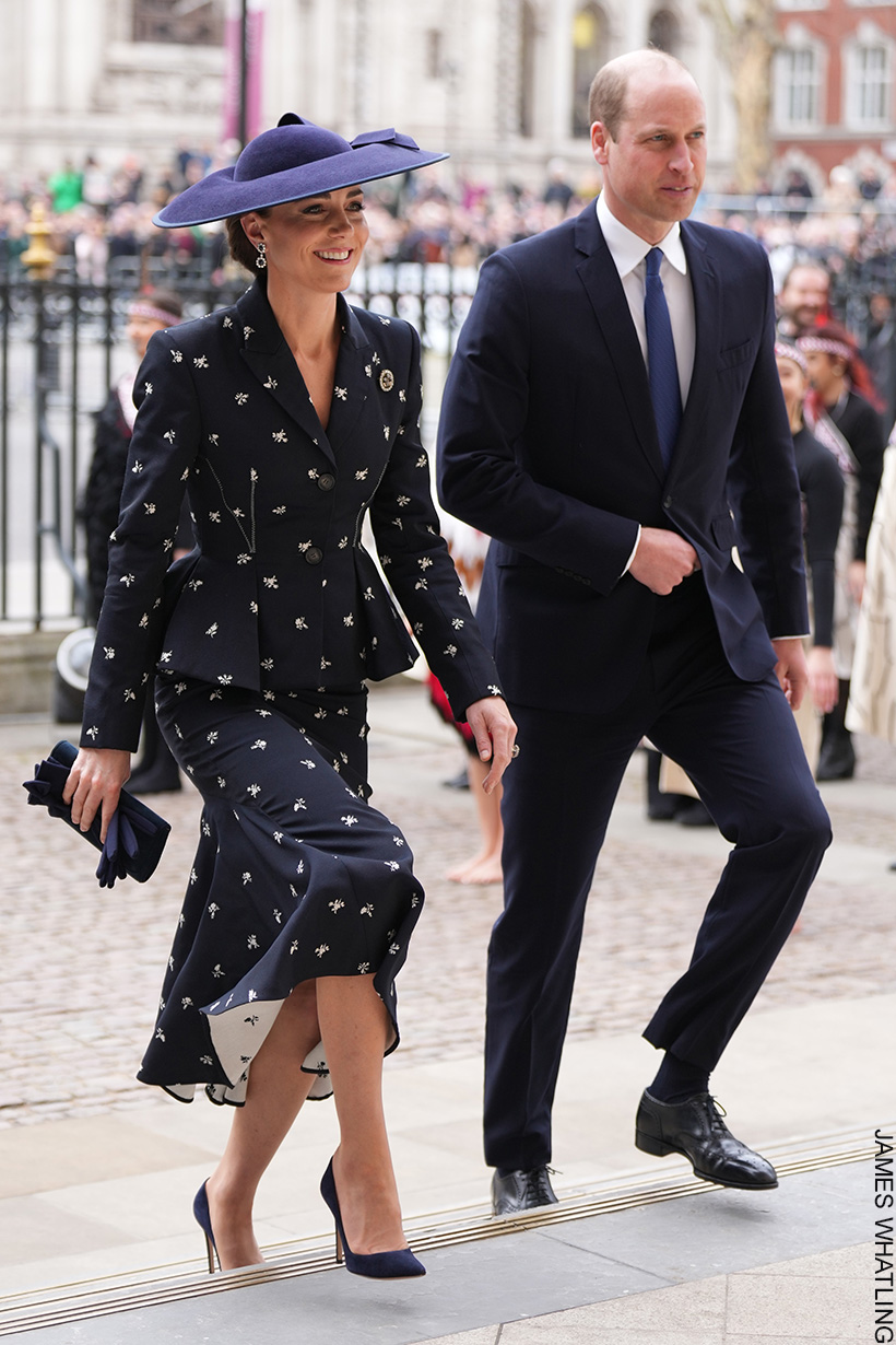 William and Kate in coordinating navy outfits walking into Westminster Abbey