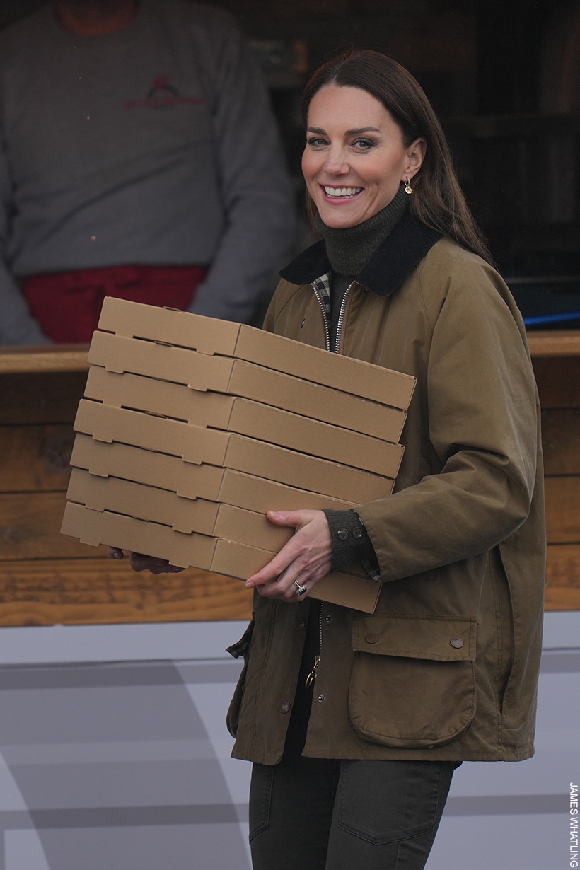 Kate Middleton holding pizza boxes