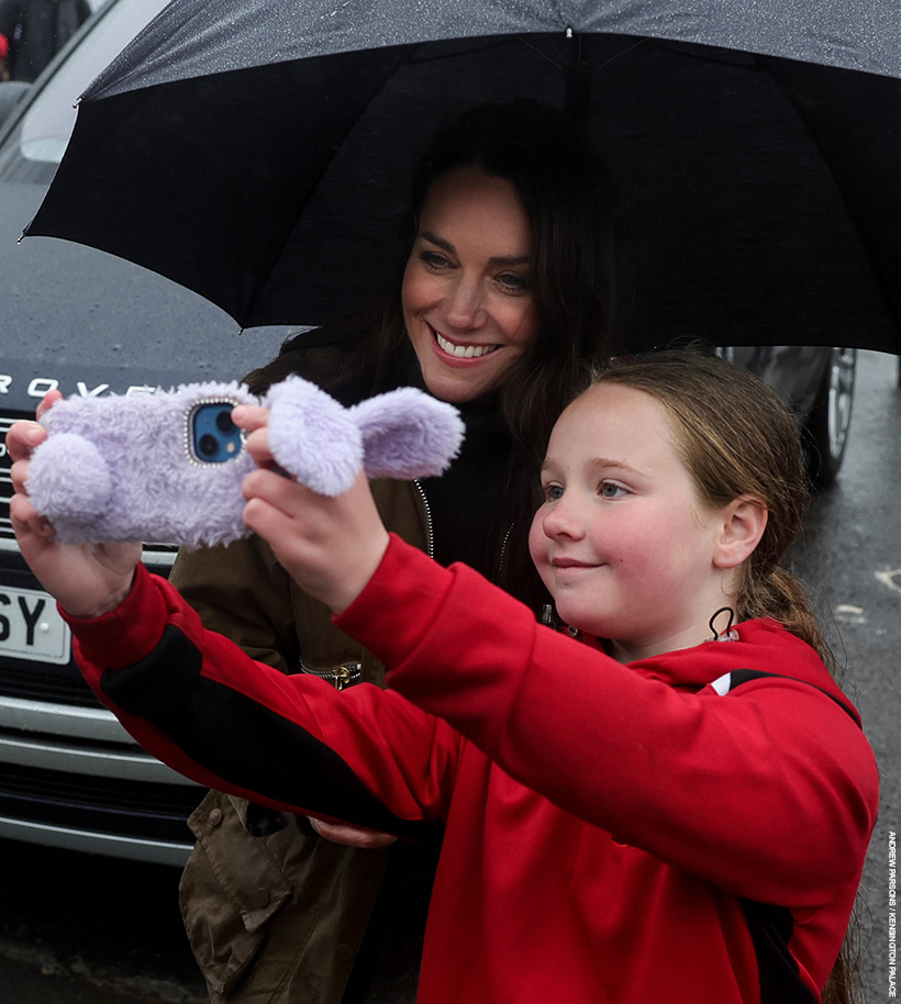 Kate Middleton poses for a selfie with a young fan