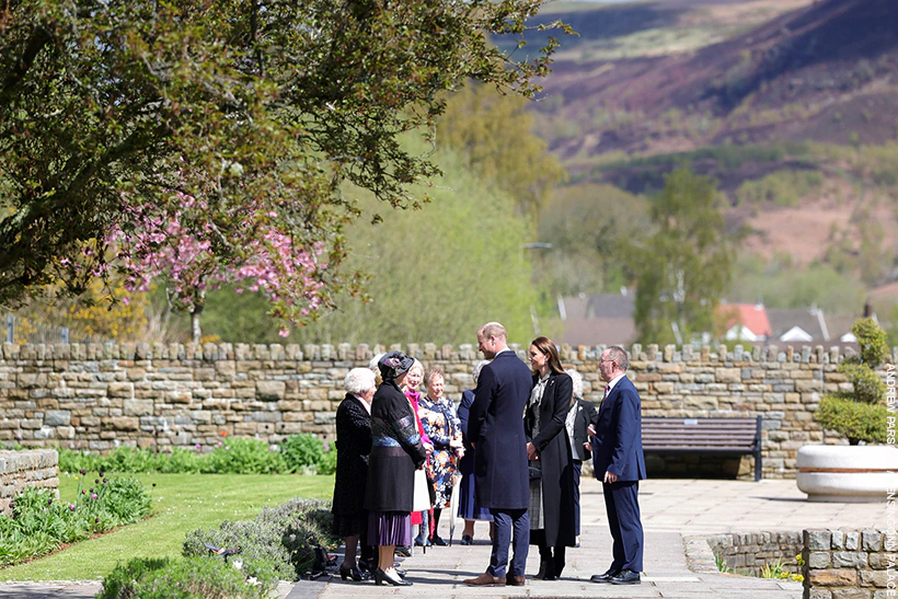 Kate Middleton in black for Aberfan; Adorable baby swipes her bag!