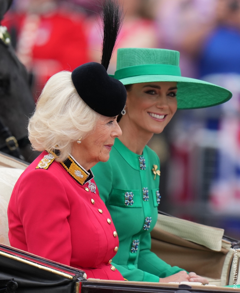 Kate Middleton sat, smiling, with Queen Camilla at Trooping the colour.