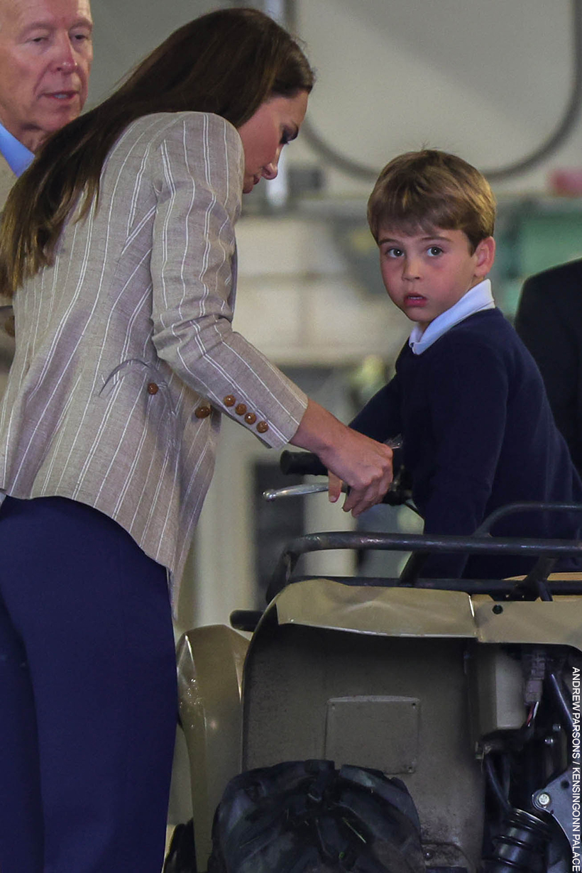 Kate wearing the blazer as she helps Geroge