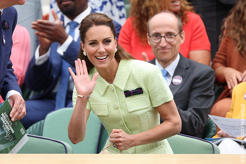 Kate takes her seat wearing the bold lime green dress
