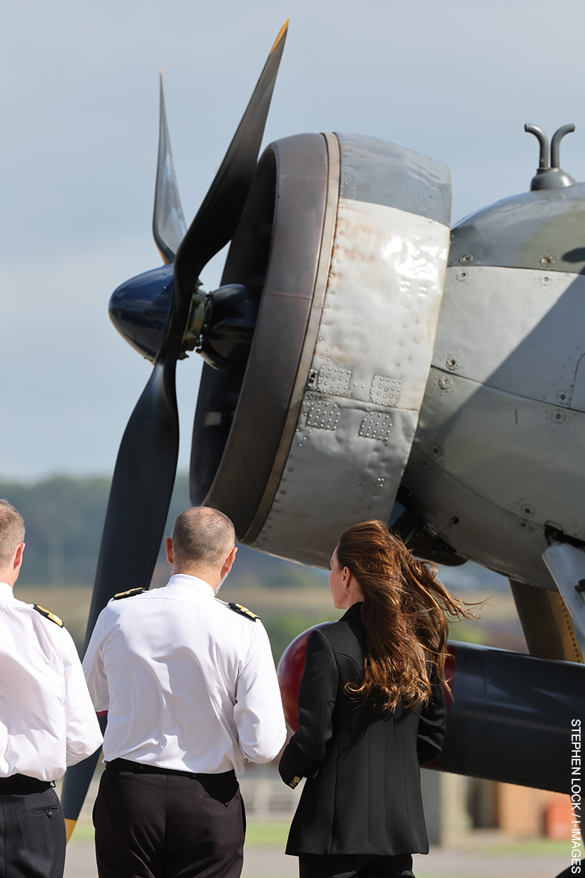 Kate Middleton stood in front of a plane.