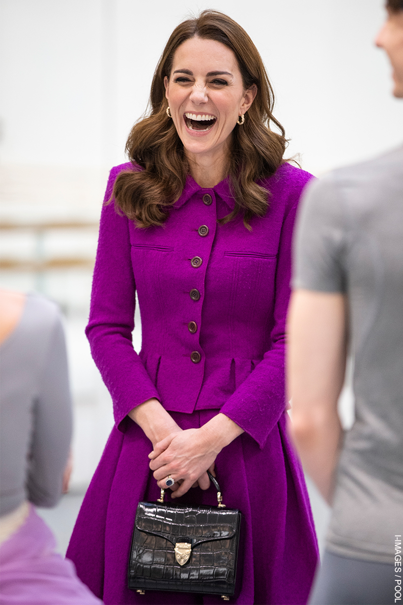 Dressed in a purple skirt suit, the Princess of Wales carries a black Aspinal of London Midi Mayfair Bag