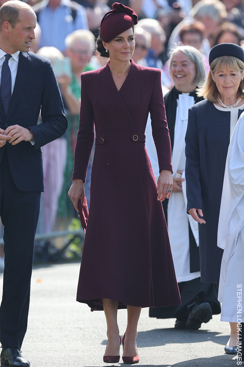 Kate Middleton in St David's Today.  The Princess of Wales wore a deep burgundy coat dress and matching accessories.
