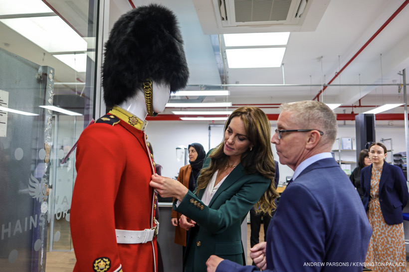 Kate Middleton inspecting a ceremonial uniform on a mannequin at the mill.