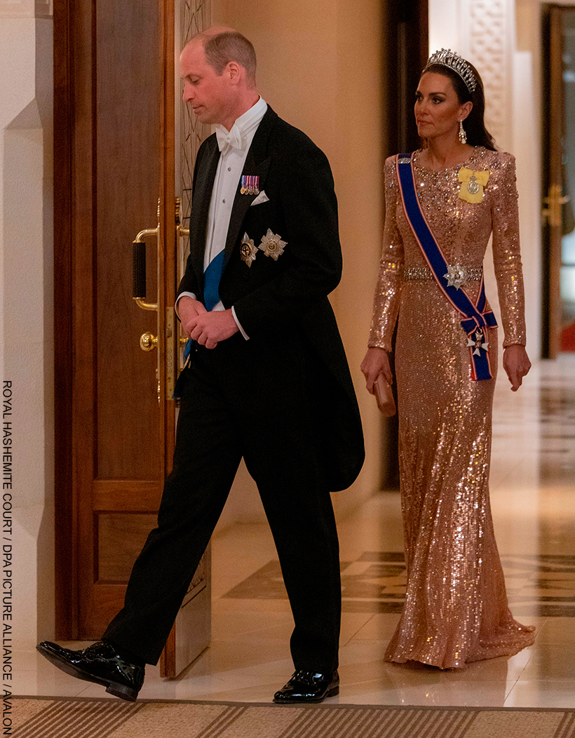 Kate Middleton chatting with guests at the Jordan Royal Wedding in 2023.  She wears the Queen Mary Lover's Knot Tiara with a shimmering pink gown.