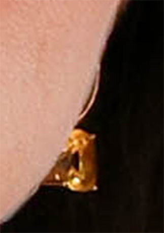 Close up detail showing Kate Middleton's ear, and the citrine drop earrings