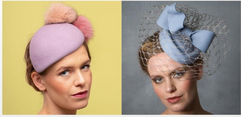 Two hats from Sahar Millinery.  One features a pink teardrop base topped with pink pom poms.  The other hat is a blue pillbox with netting, topped with a bow.