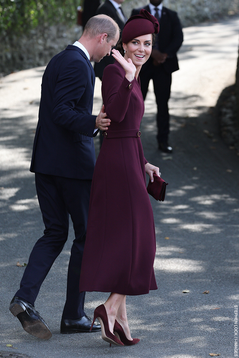 William and Kate in St Davids, leaving the cathedral.  Kate is wearing a deep burgundy outfit.