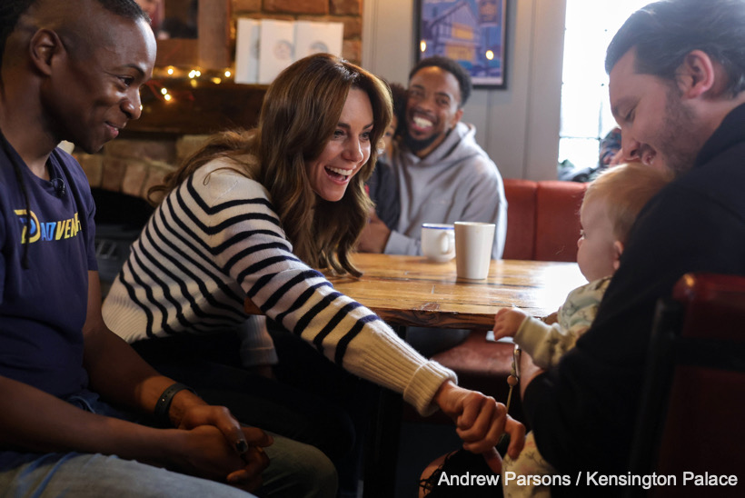 Kate Middleton gently chats to a baby