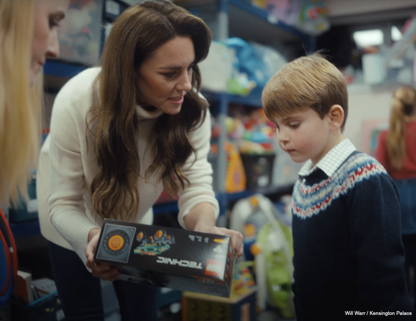 Kate and Louis look at a Lego Technic toy
