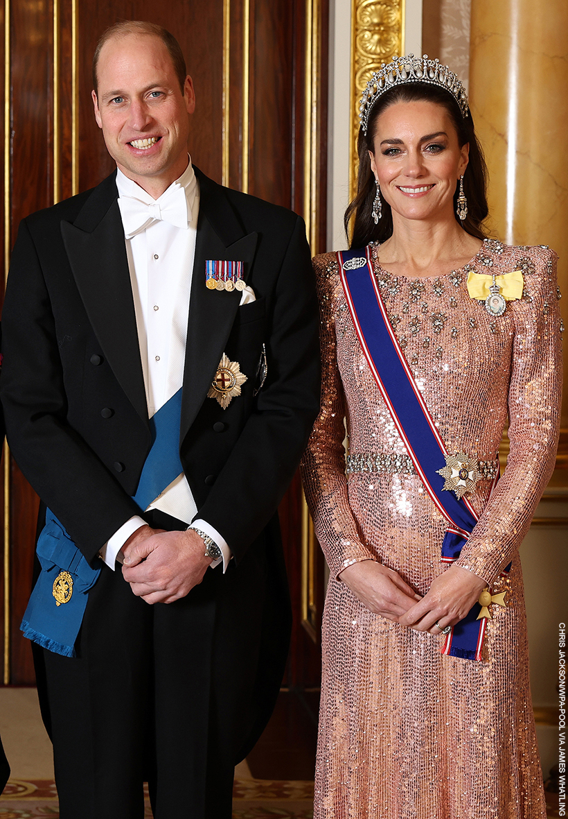 Kate Middleton and Prince William posing together, with Kate wearing a formal rose pink gown by Jenny Packham and the Queen Mary Lovers Knot Tiara, at the 2023 Diplomatic Reception