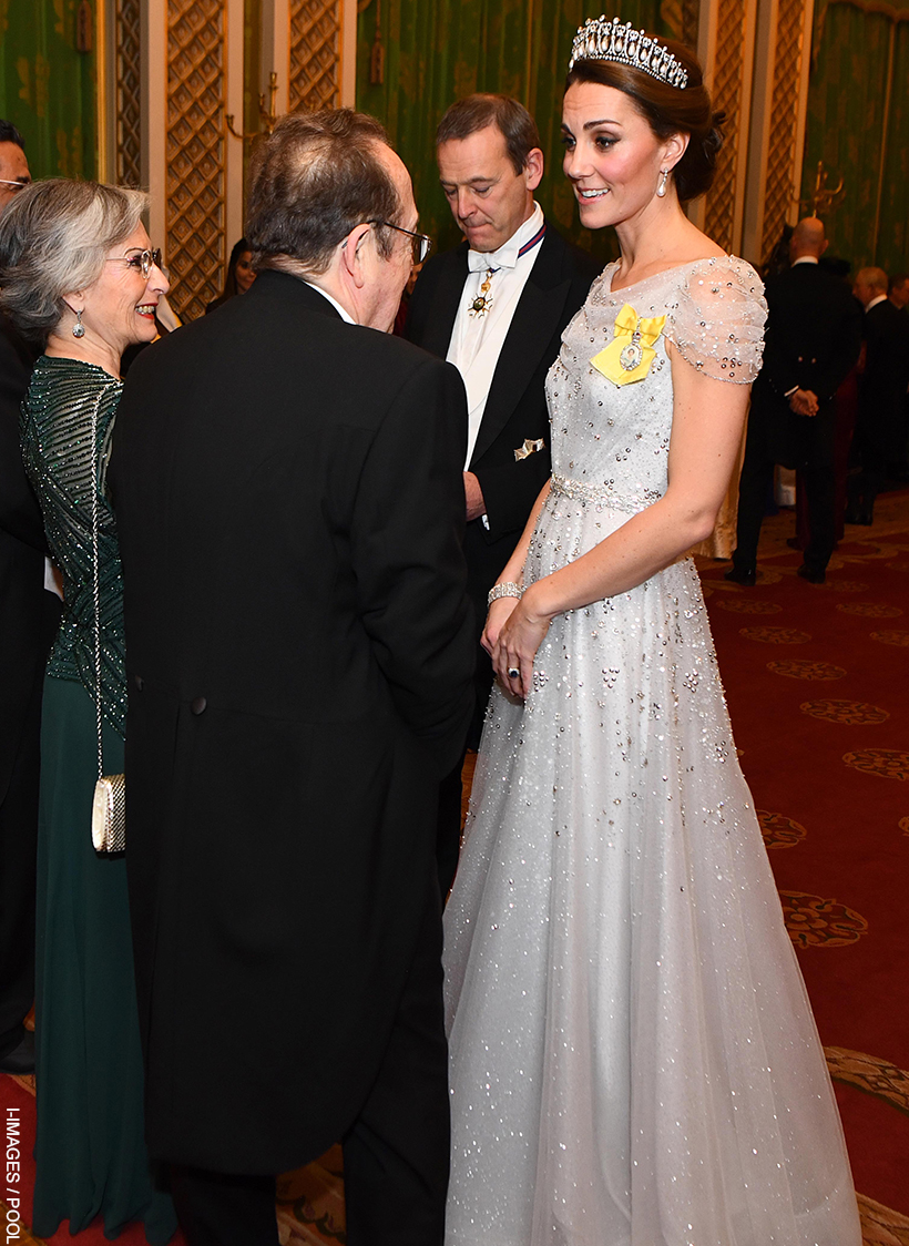 Princess Kate in conversation at the Diplomatic Reception, wearing a sparkling silver Jenny Packham gown, adorned with the Lover's Knot Tiara and Royal Family Order.