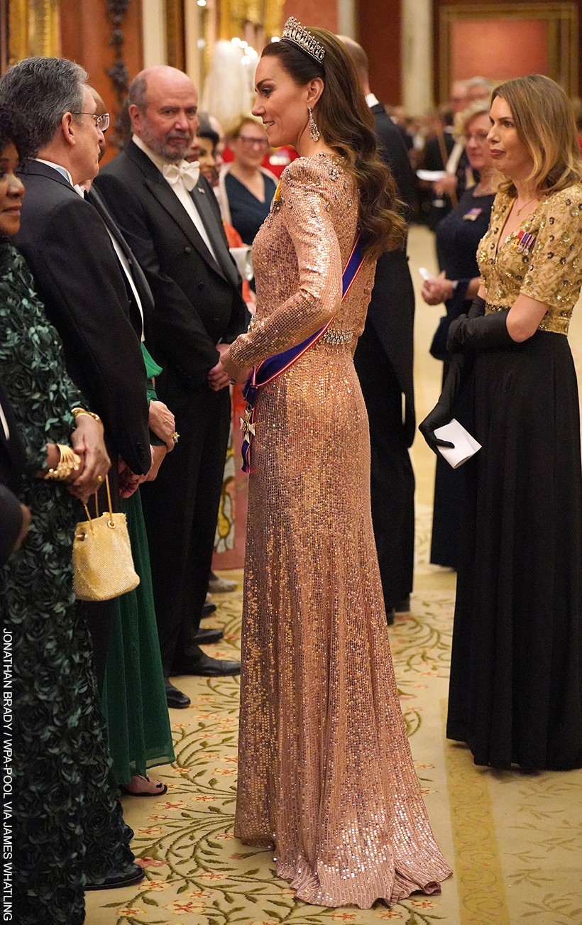 Kate Middleton, in conversation, at the Diplomatic Reception wearing a soft pink gown with glittering jewels