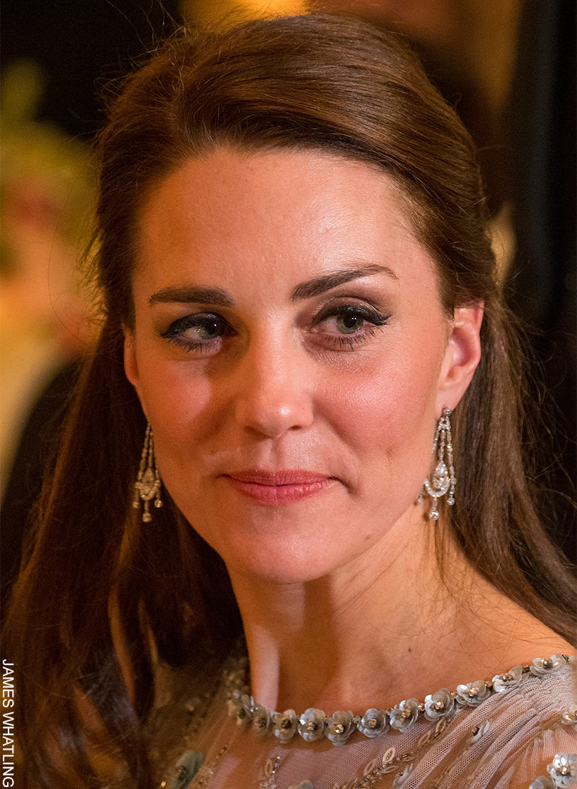 Kate Middleton wears her hair tied back, showing off the Queen Elizabeth Diamond Chandelier Earrings.