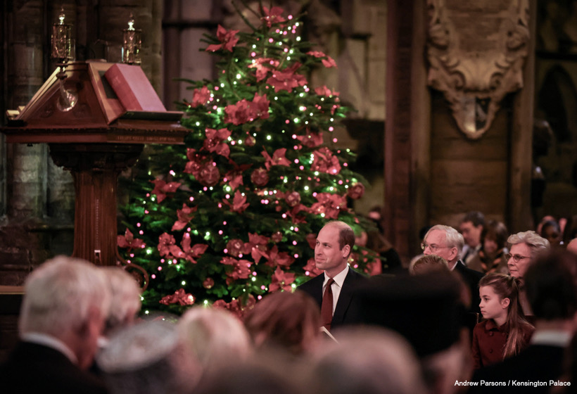 Prince William, Princess Charlotte and members of the congregation at the Together For Christmas service, with a festive Christmas tree and decorations in the background