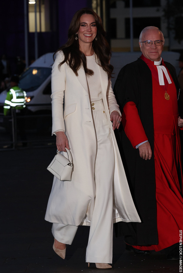 Kate Middleton, the Princess of Wales, wears white coat, trousers and sweater as she attends the Together at Christmas Carol Concert