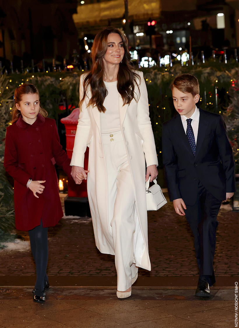Kate Middleton, central, in a white outfit, walking with her two eldest children.