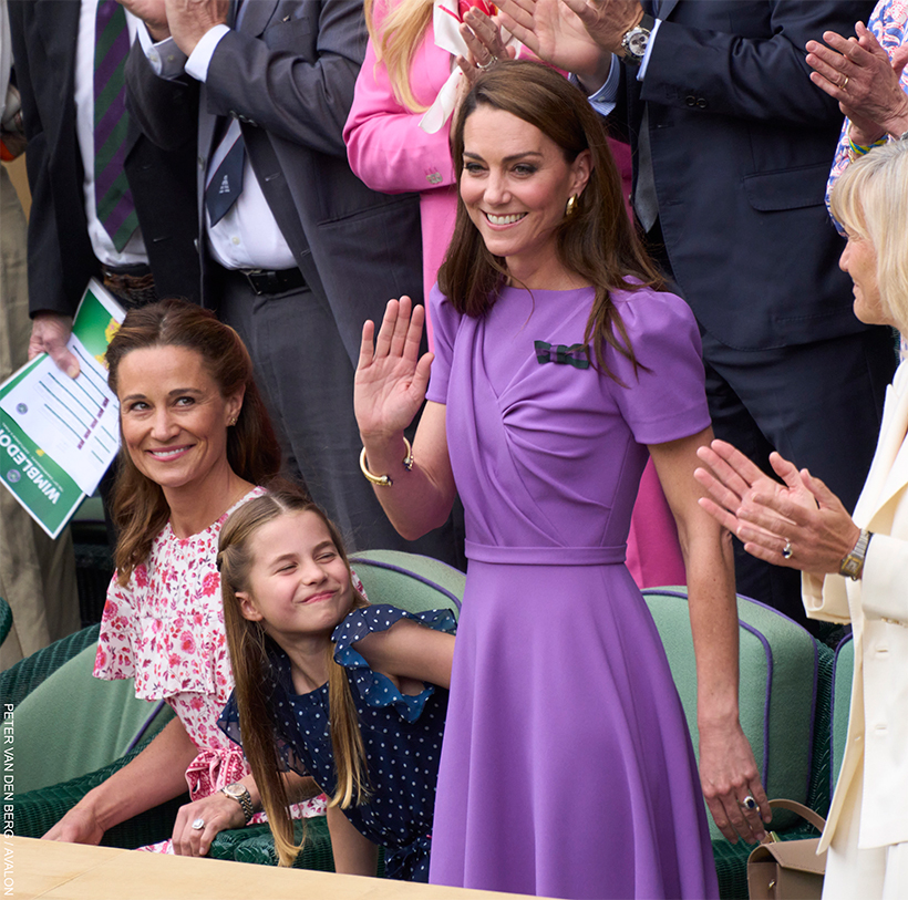 Kate Middleton waves as she receives a standing ovation 