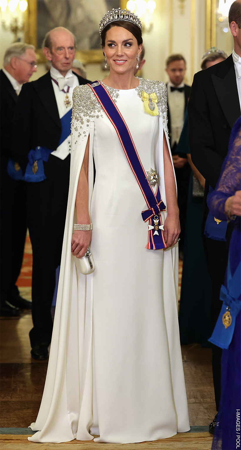 The Princess of Wales in a white cape gown with tiara and embellishments 