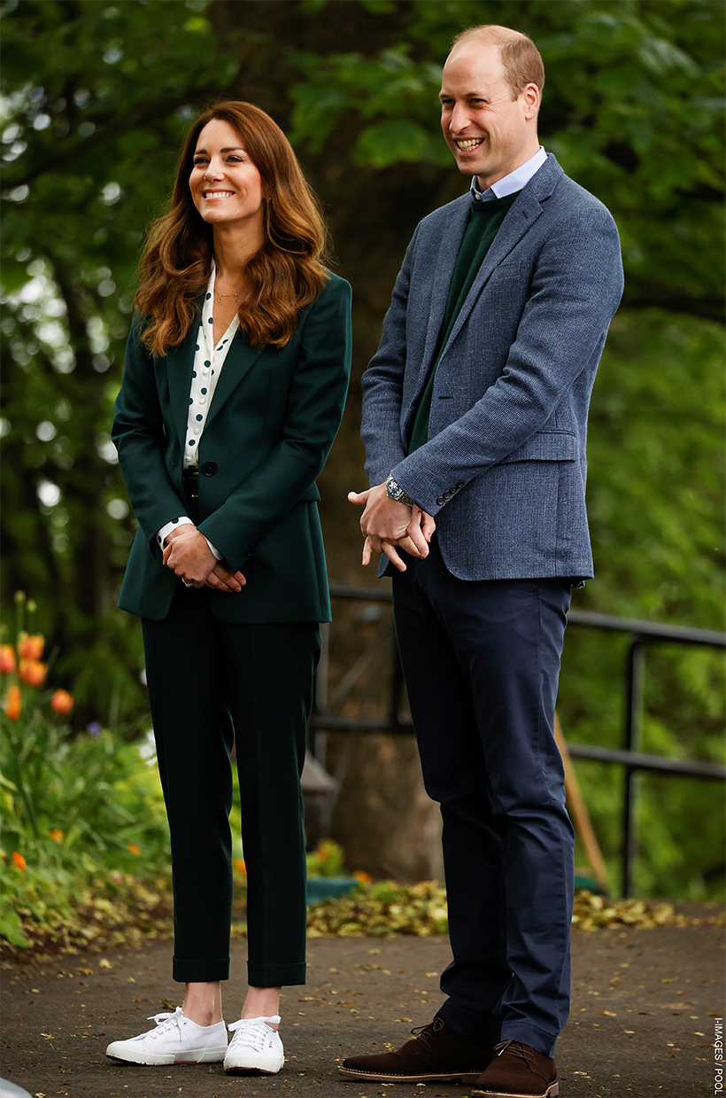 Kate Middleton wears green pants, shirt and blazer with white sneakers