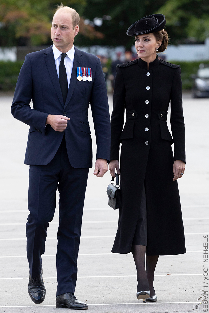 The Prince and Princess of Wales on a royal engagement. The Princess wears a black military-inspired coat