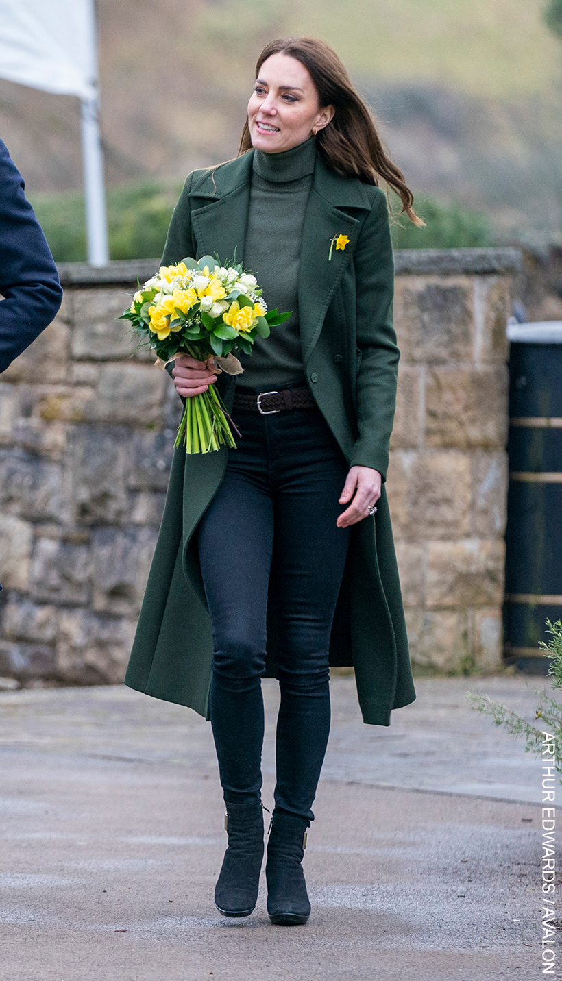 Kate Middleton shows how skinny jeans can still look stylish in colder weather when paired with a long coat, knitwear and boots.