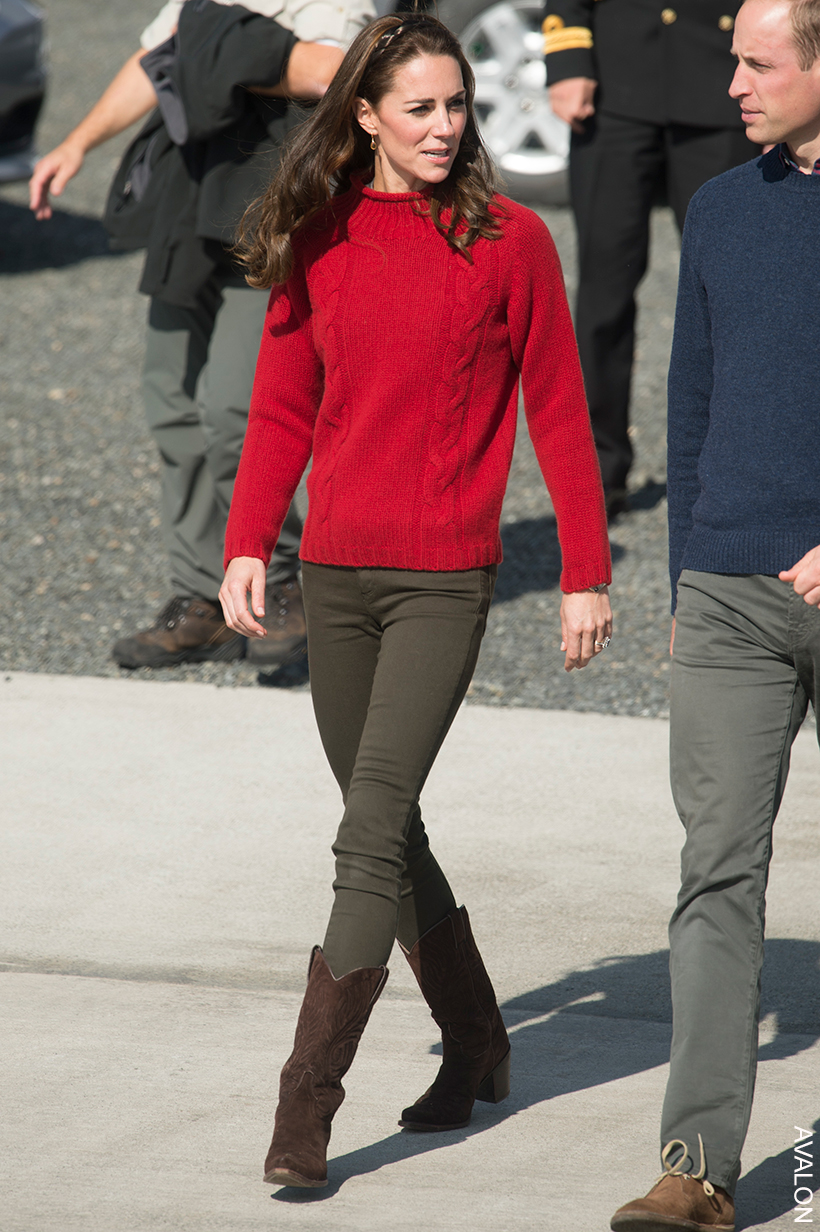 Kate Middleton paired khaki jeans with brown cowboy boots and a thick red sweater, finishing the look with a headband