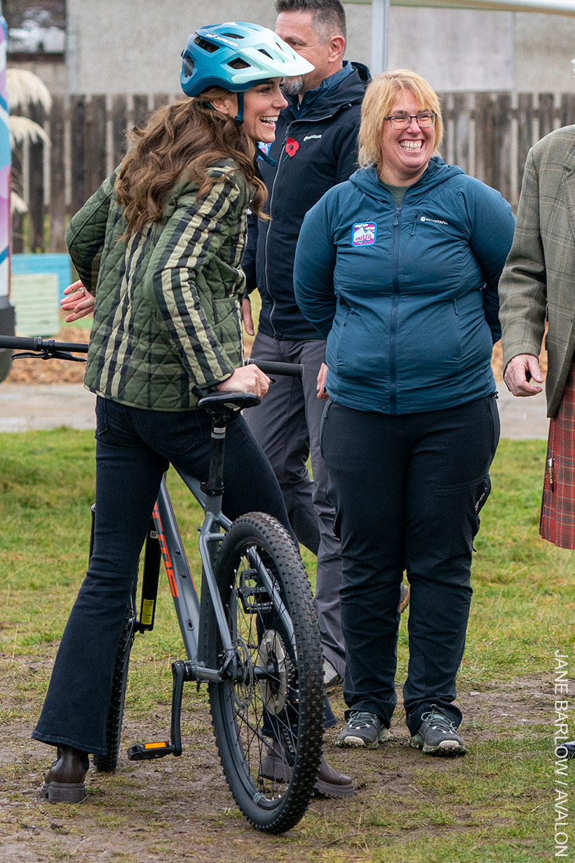 Kate Middleton wore dark blue cropped skinny flared jeans, ankle boots and a plaid jacket.