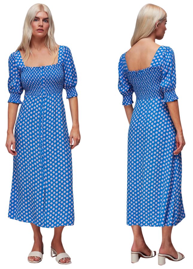 A model from Whistles wears a blue shirred dress with daisy print 