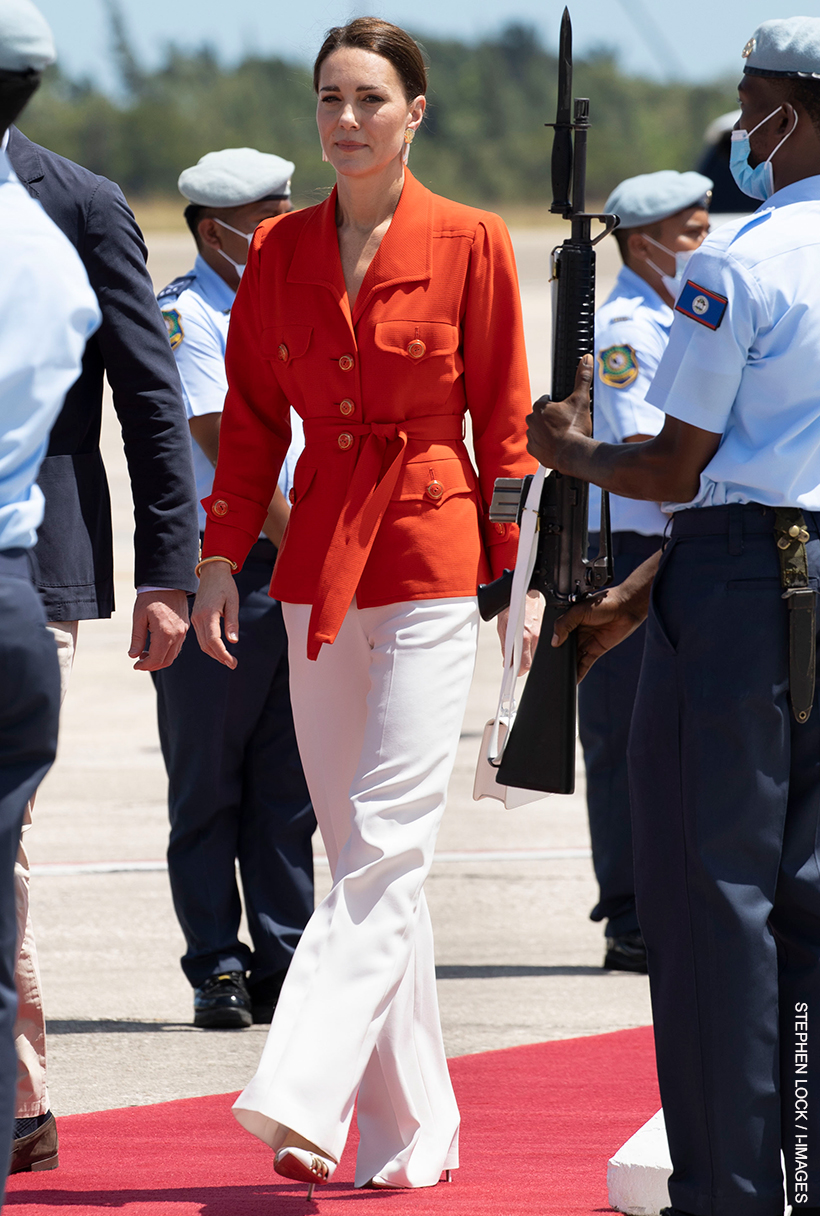 The Princess of Wales wearing the red jacket with white trousers in 2022