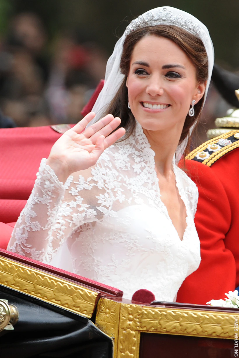 Kate Middleton waving on her wedding day, wearing the Cartier 'Halo' tiara