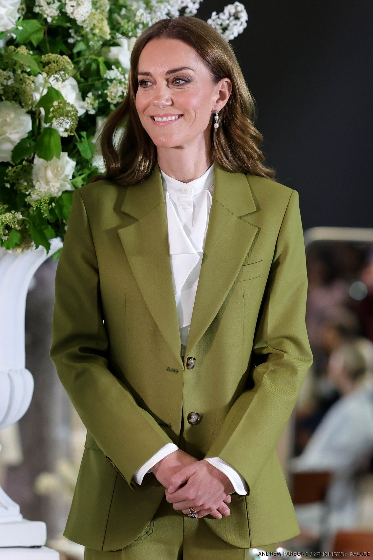 The Princess of Wales at the British Fashion Council event earlier this year, wearing a pea green suit and the ruffled blouse