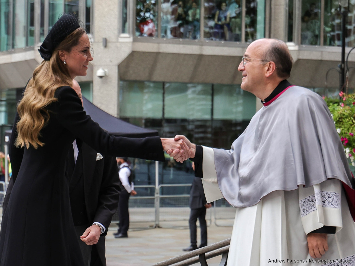 The Princess of Wales shaking hands with a member of the Catholic church
