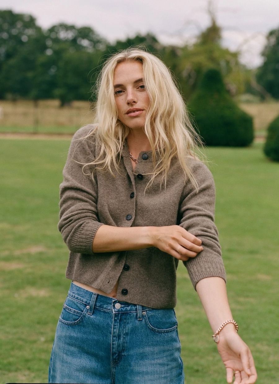 An editorial shot of the brown cardigan on the model