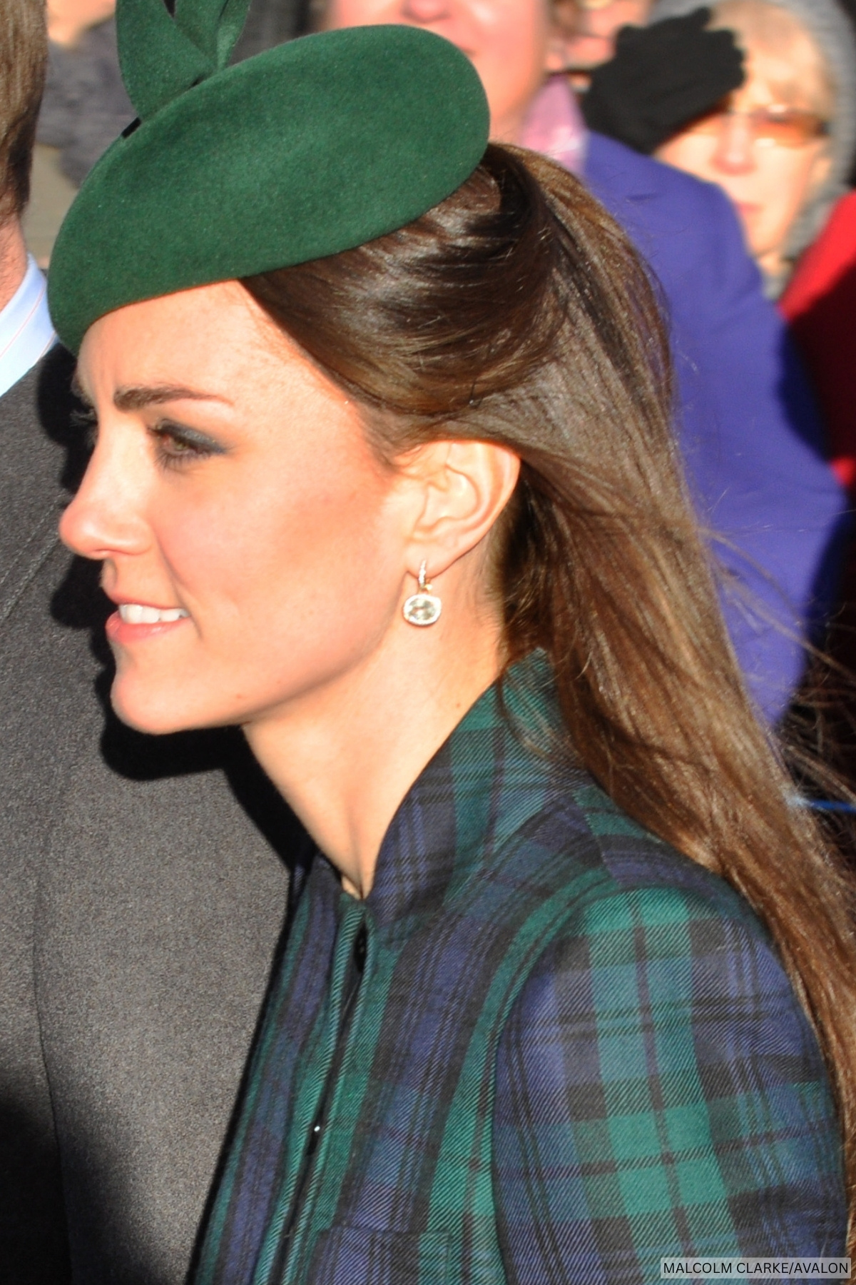 A close-up of the Princess of Wales at Sandringham on Christmas Day, wearing a blue and green blackwatch tartan dress.