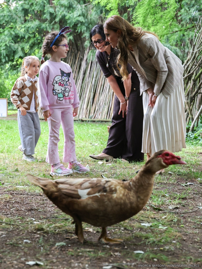 Kate Middleton chatting and laughing with pre-school children at Salvador Allende pre-school in Reggio Emilia.